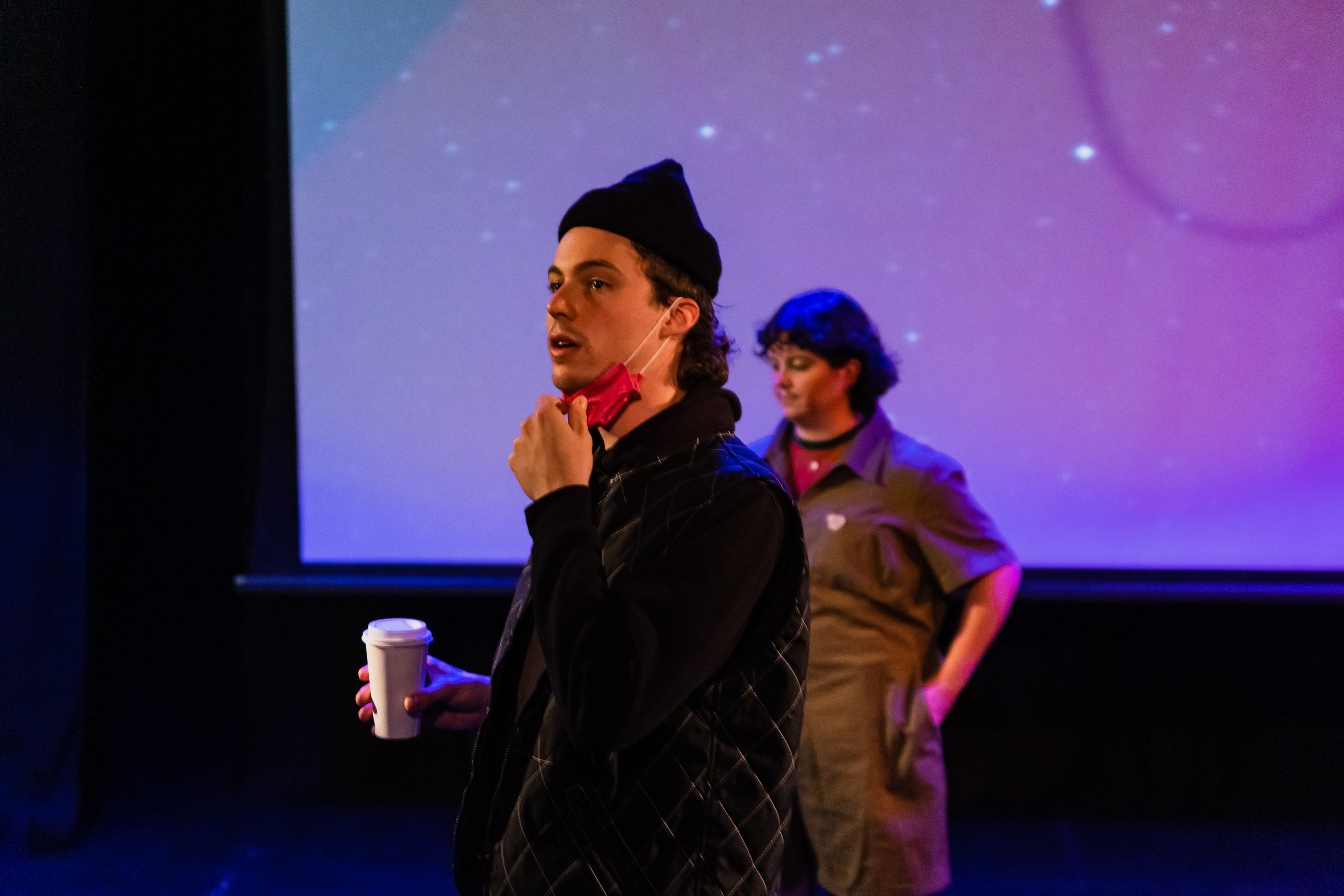 peter sarty pulling down his mask with stevey in the background